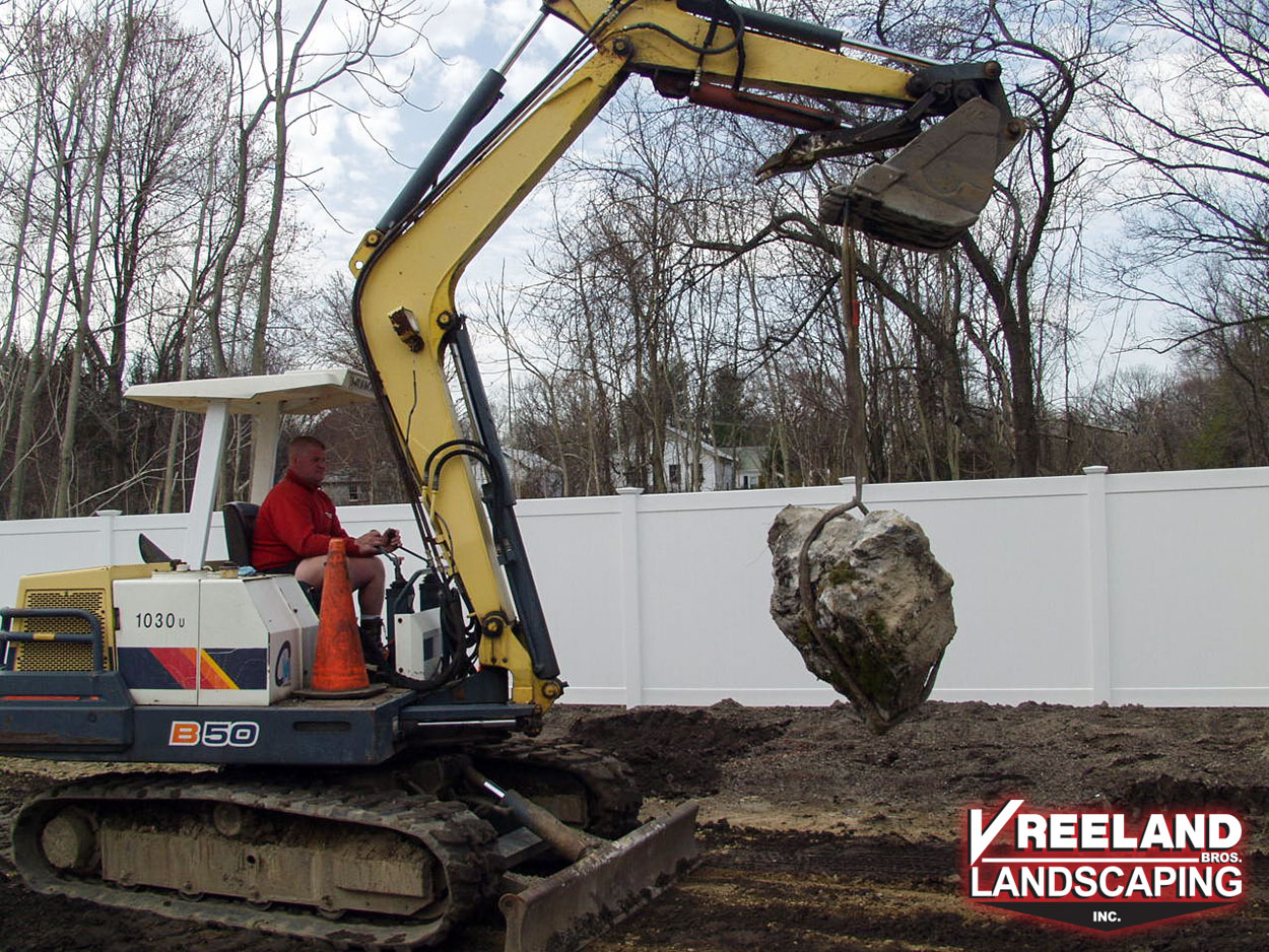 West Milford, NJ, VBL partner Wayne Vreeland removing a large boulder while grading a site 